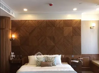 Luxurious bedroom with elegant wood paneling and stylish decor