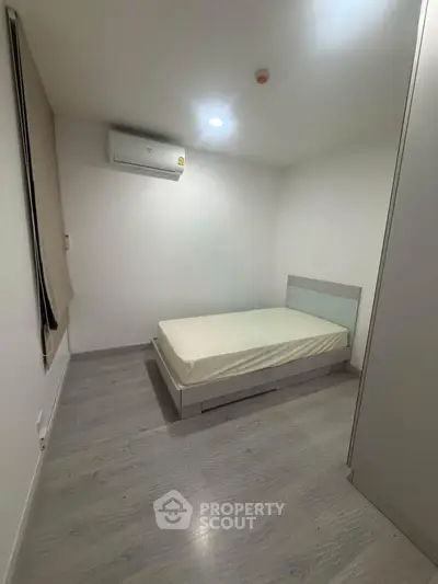 Minimalist bedroom with modern design and air conditioning