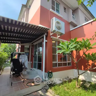 Charming two-story house with garden and patio in a serene neighborhood.