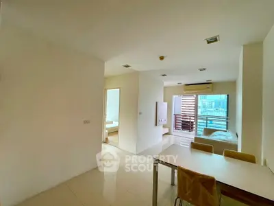 Spacious modern apartment with open layout and city view, featuring sleek interiors and abundant natural light.