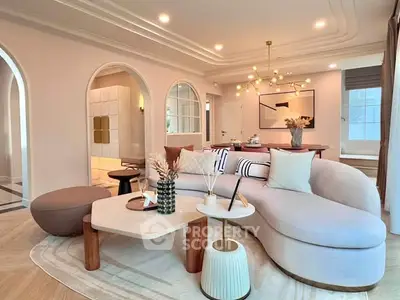 Luxurious modern living room with elegant curved sofa and stylish decor