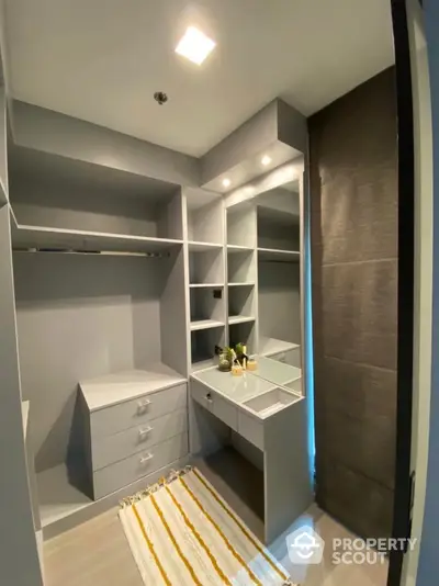 Luxurious walk-in closet with modern design and ample storage space