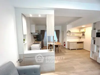 Modern open-plan living room with stylish kitchen and dining area