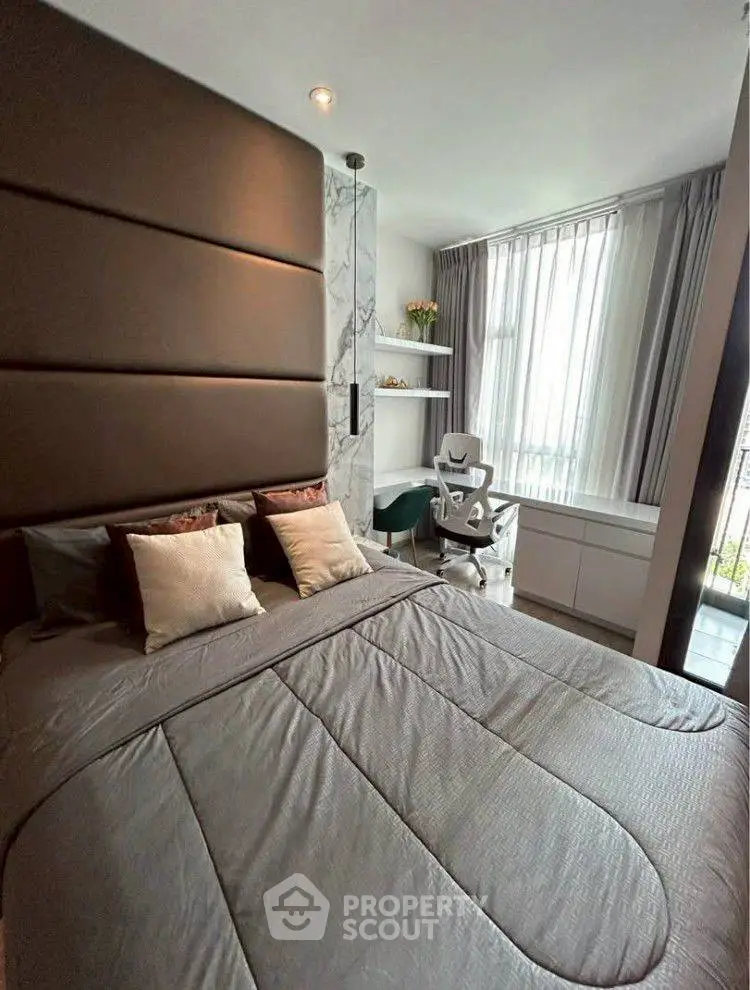 Modern bedroom with stylish decor and natural light