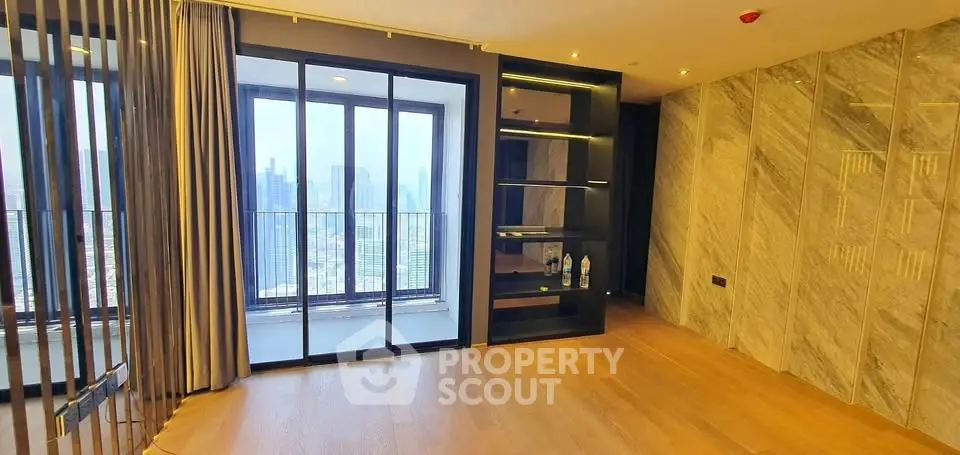 Luxurious high-rise apartment with stunning city view and elegant interior design.