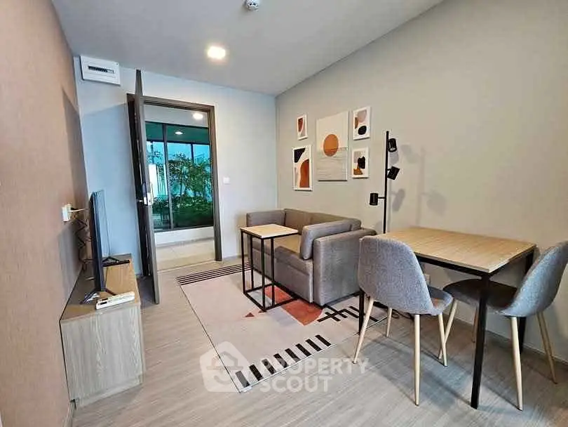 Modern living room with stylish decor and cozy seating area in a contemporary apartment.