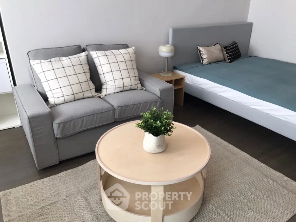Modern studio apartment with cozy living area and stylish decor