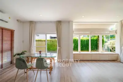 Spacious living room with large windows and elegant decor in modern home