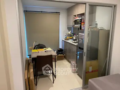 Compact kitchen with dining area in modern apartment