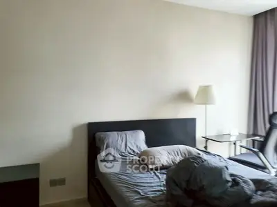 Cozy bedroom with modern furnishings and natural light