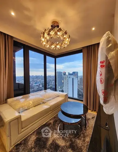 Luxurious living room with panoramic city view and elegant chandelier