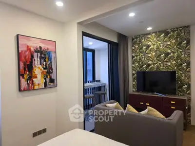 Modern living room with stylish decor and balcony access in a contemporary apartment.