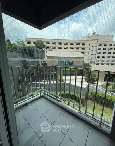 Charming balcony with city view, perfect for relaxation and enjoying the outdoors.