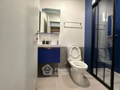 Modern bathroom with sleek design and glass shower enclosure
