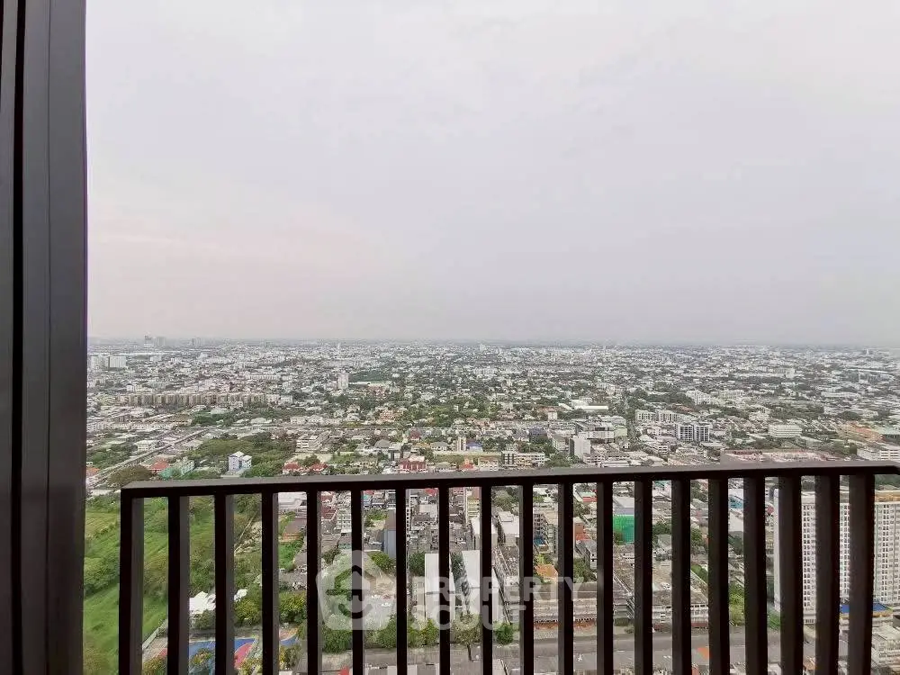 Stunning panoramic city view from high-rise balcony, perfect for urban living.