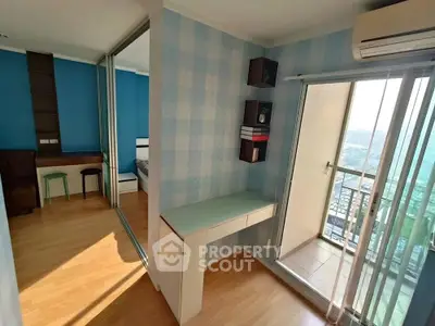 Modern apartment with study area and balcony offering stunning city views.