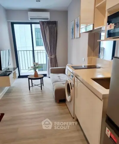 Modern apartment living room with washing machine and balcony view