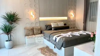 Luxurious modern bedroom with elegant decor and ambient lighting