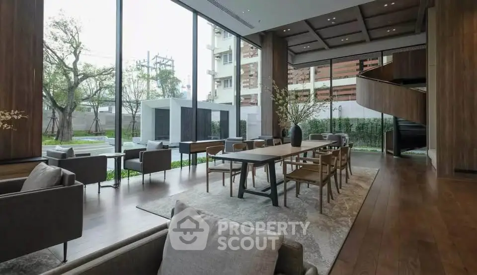 Luxurious modern living room with large windows and elegant wooden flooring