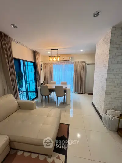 Spacious living room with elegant dining area and modern decor