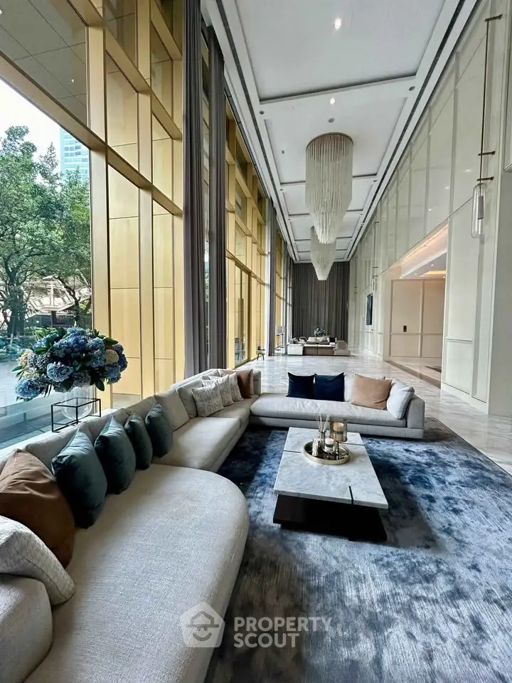 Luxurious living room with floor-to-ceiling windows and elegant decor in a high-end property.