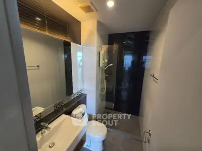 Modern bathroom with sleek design and glass shower enclosure