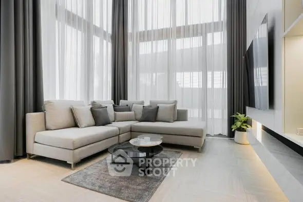 Luxurious modern living room with high ceilings and elegant decor