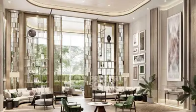 Luxurious living room with high ceilings, elegant decor, and large windows offering a serene garden view.