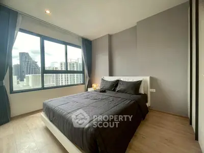 Modern bedroom with city view and sleek design