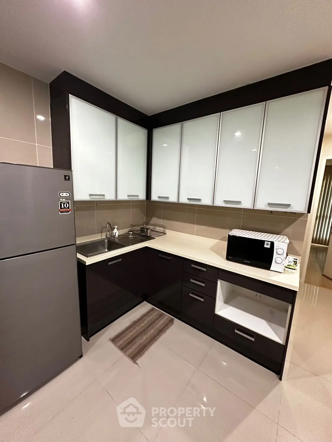 Modern kitchen with sleek cabinets and stainless steel appliances