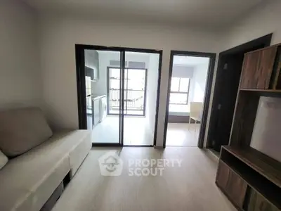 Modern apartment interior with sliding glass doors and natural light