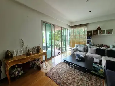 Spacious living room with elegant decor and large balcony view