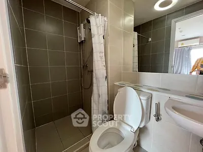 Modern bathroom with shower and toilet in contemporary apartment
