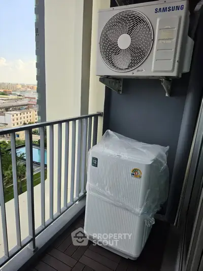 Modern balcony with air conditioning unit and city view, perfect for urban living.