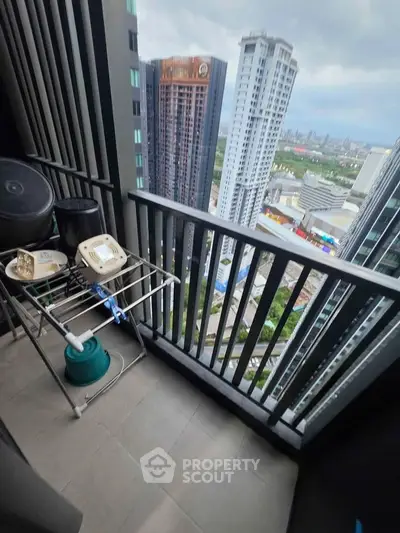 High-rise balcony with cityscape view, perfect for urban living enthusiasts.