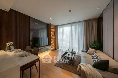 Luxurious modern living room with elegant decor and large windows offering city views.
