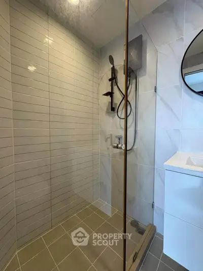 Modern bathroom with sleek shower and stylish tiles