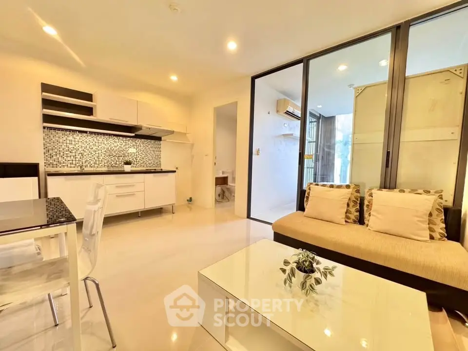 Modern open-plan living room with stylish kitchen and cozy seating area