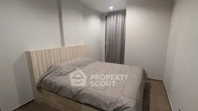 Cozy bedroom with modern decor and soft lighting, perfect for relaxation and comfort.