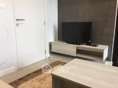 Modern living room with sleek TV stand and contemporary decor