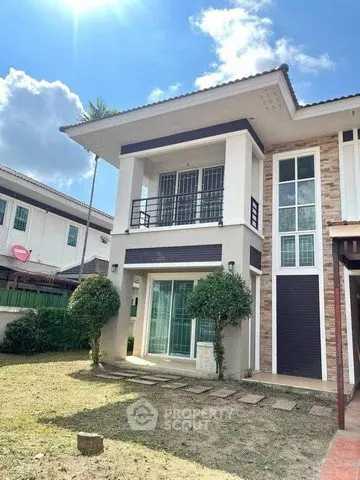Charming two-story house with modern design and spacious garden in a serene neighborhood.