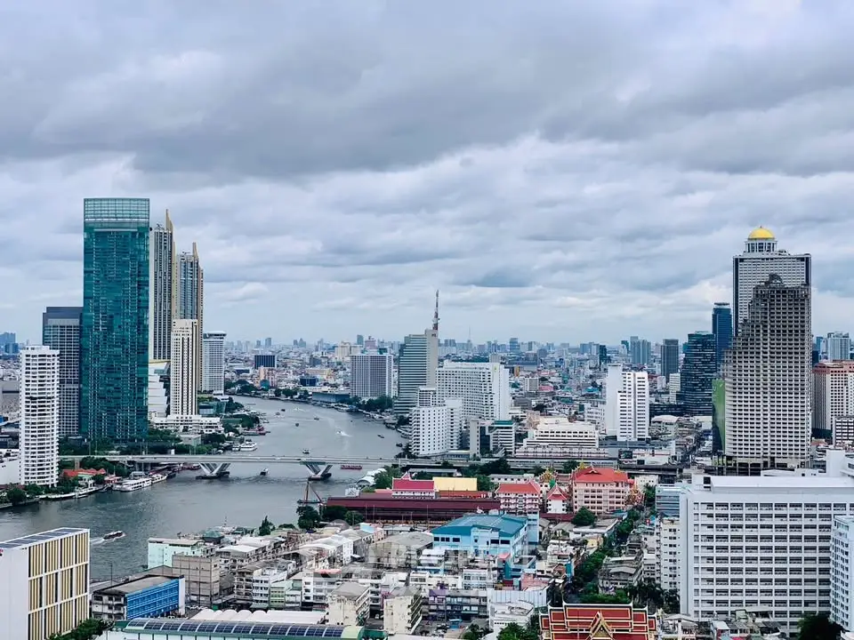 Stunning cityscape view showcasing modern skyscrapers and a river, perfect for urban living enthusiasts.