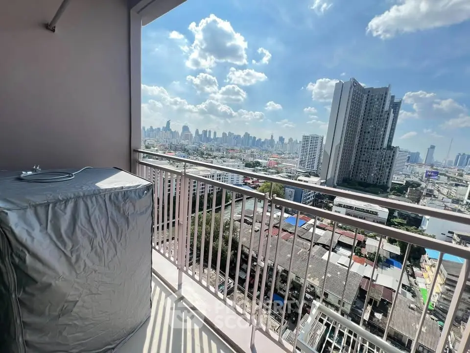 Stunning city view from high-rise balcony with protective cover on air conditioning unit.