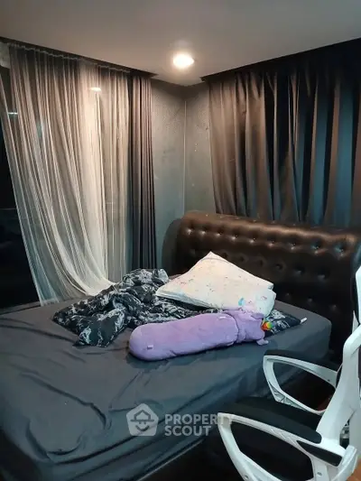 Cozy bedroom with modern decor and stylish curtains