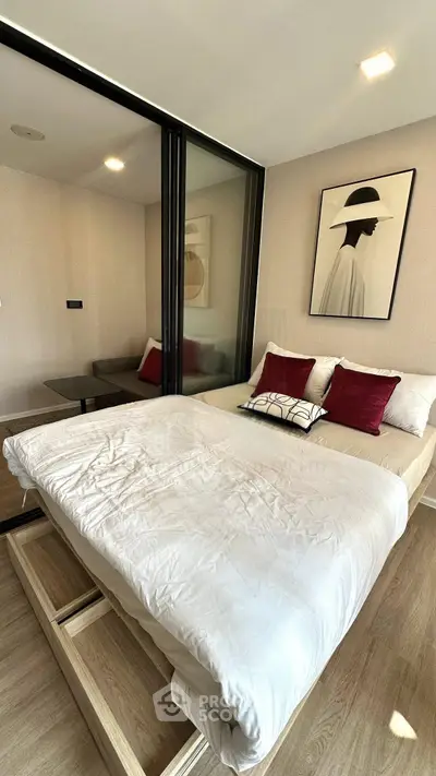 Modern bedroom with stylish decor and glass partition in a contemporary apartment