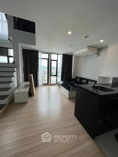 Modern duplex living room with sleek design and city view