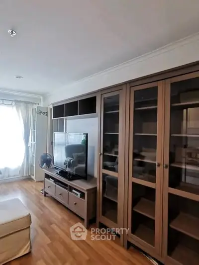 Spacious living room with elegant wooden furniture and natural light