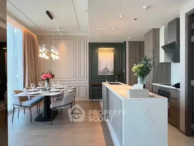 Luxurious open-layout kitchen and dining area with elegant decor and modern appliances.