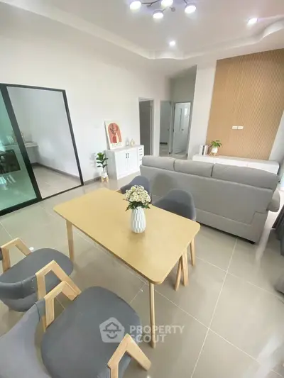 Modern living room with stylish furniture and open layout, perfect for family gatherings.