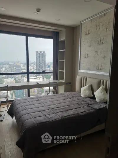 Modern bedroom with city view and stylish decor in high-rise apartment